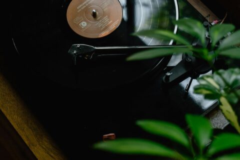 black turntable on brown wooden table
