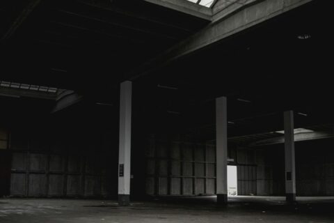 selective focus photography of white and black building