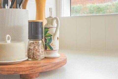 brown wooden rolling pin on brown wooden chopping board