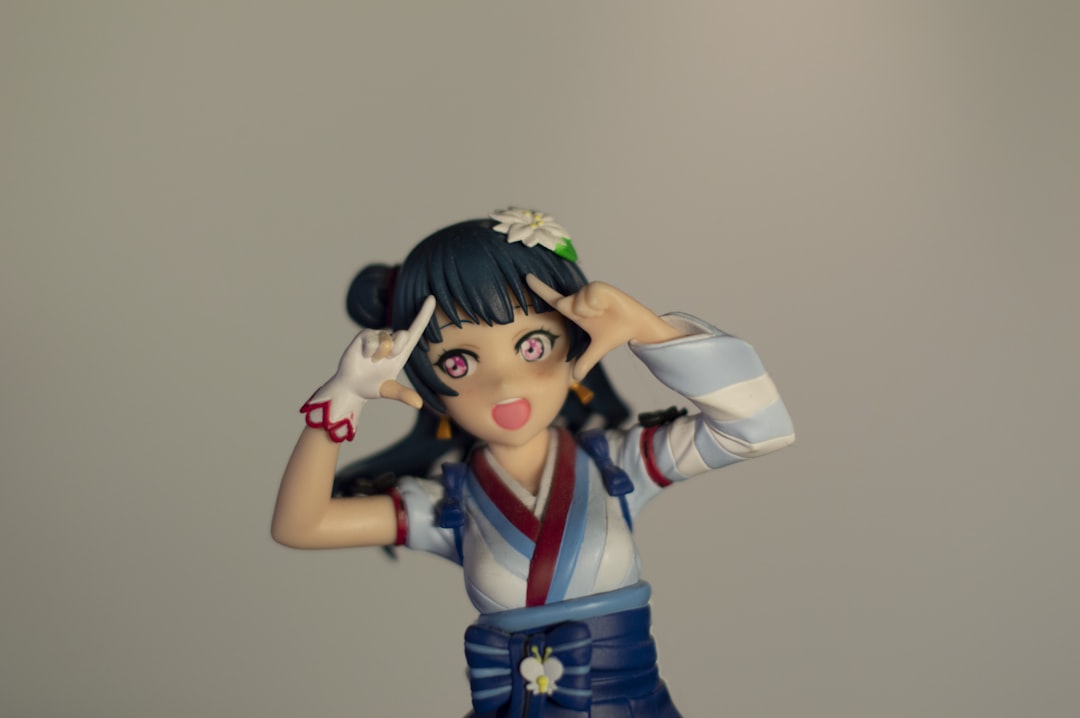 a figurine of a woman with a flower in her hair
