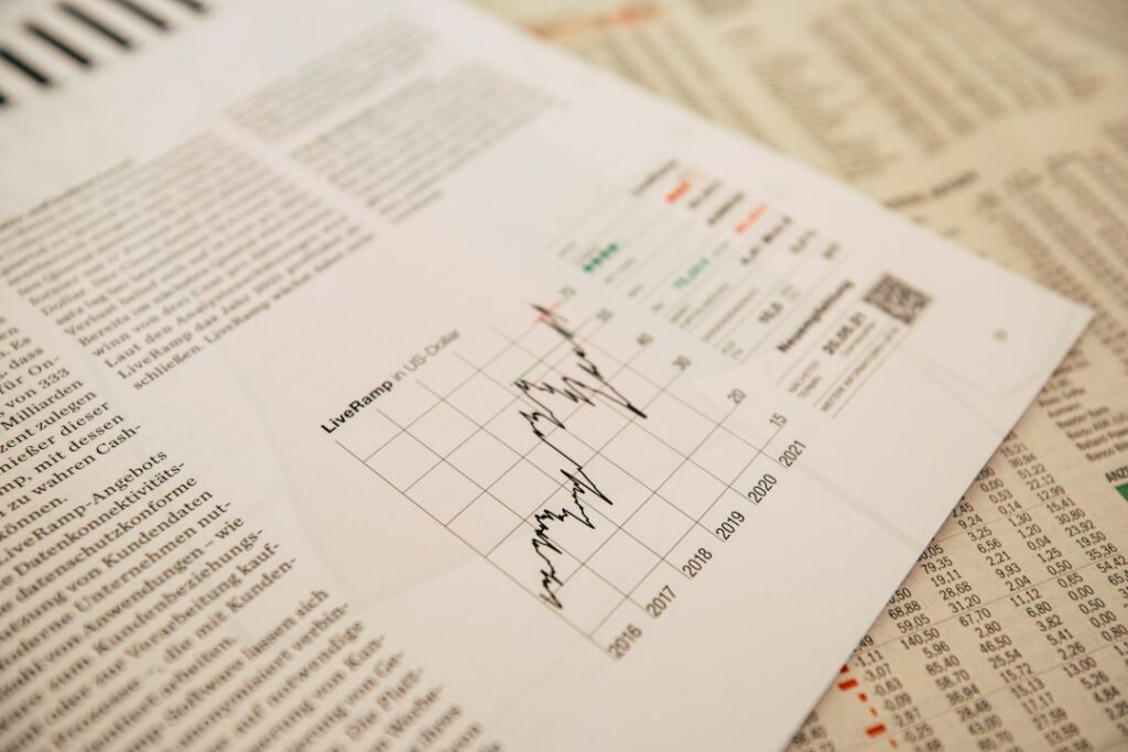 financial newspaper with stock chart