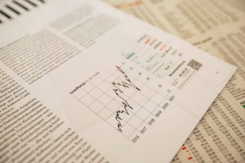 financial newspaper with stock chart