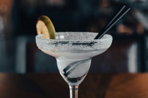 a glass with a drink in it