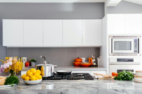 modern white kitchen with marble island