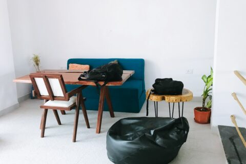 a living room filled with furniture and a blue couch