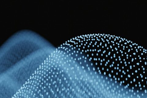 Abstract blue waves of glowing particles