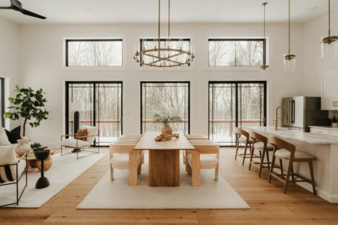 Modern dining and living area with large windows